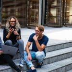 Students sitting on university steps