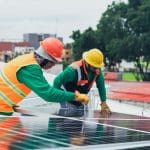 Field technicians installing solar panel